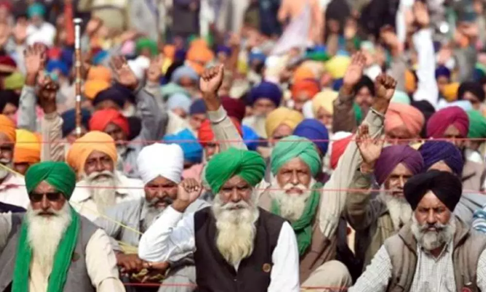 Farmers’ stir: Protestors do yoga on highway