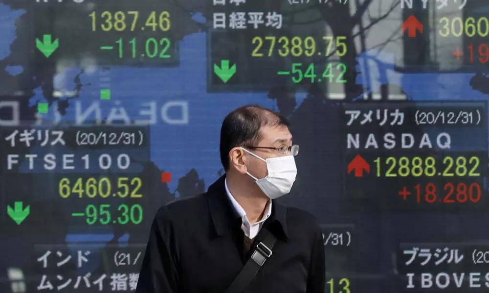 Asian shares mixed after strong earnings, data lift Wall St