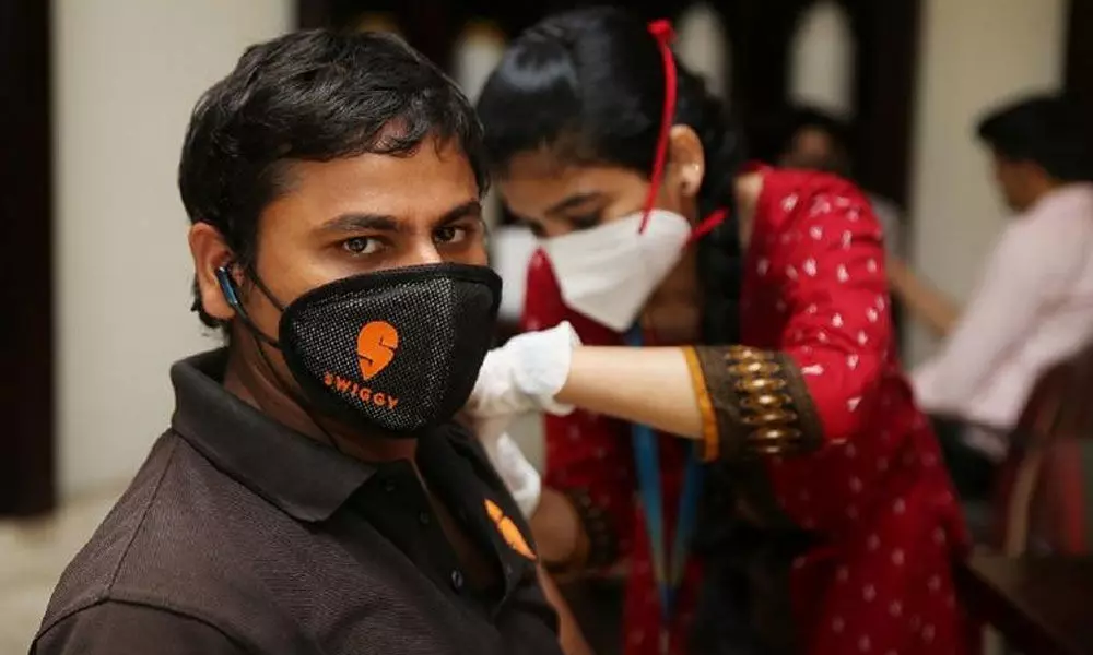 Swiggy vaccinate delivery partners, frontline staff in Bengaluru