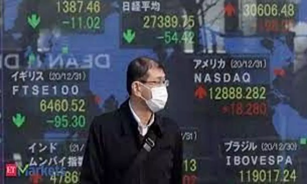 Asian stocks mixed, Tokyo gains after Wall Street soars