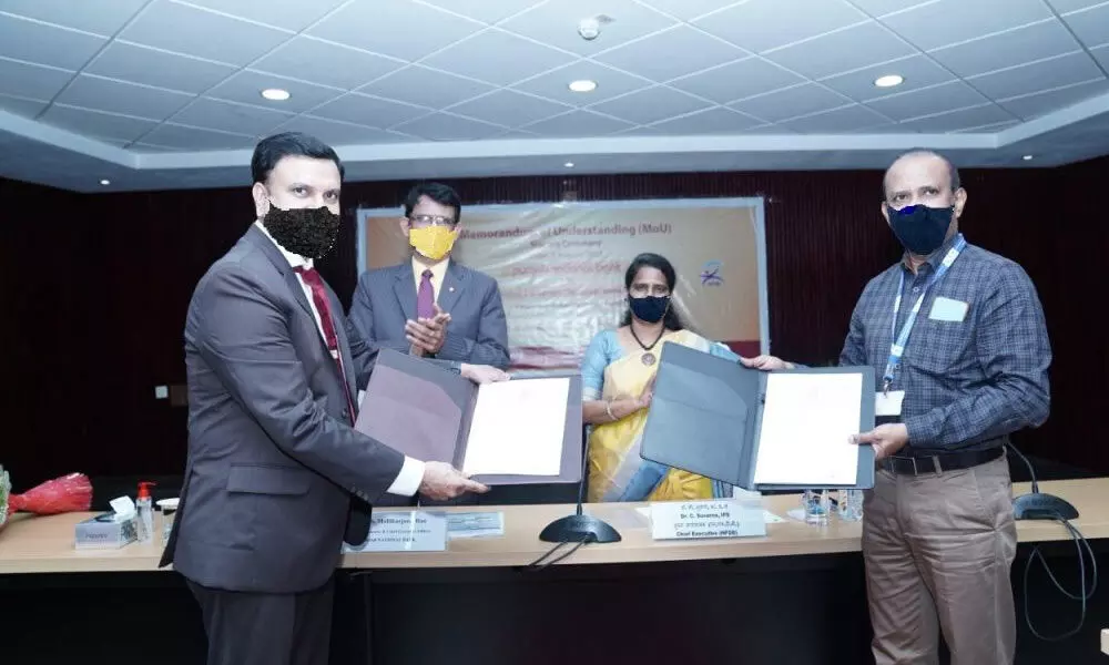 MoU documents being signed in the presence of Suvarna Chandrappagari, Chief Executive, NFDB, CHSS Mallikarjuna Rao, MD and CEO, PNB in Hyd on Thursday.