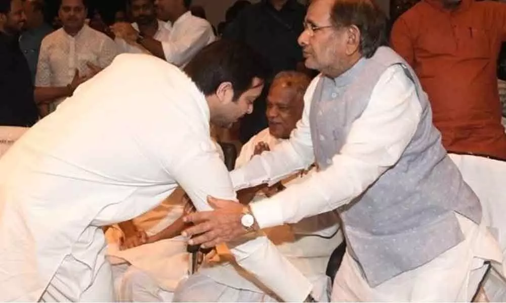 Sharad Yadav merges his party with RJD