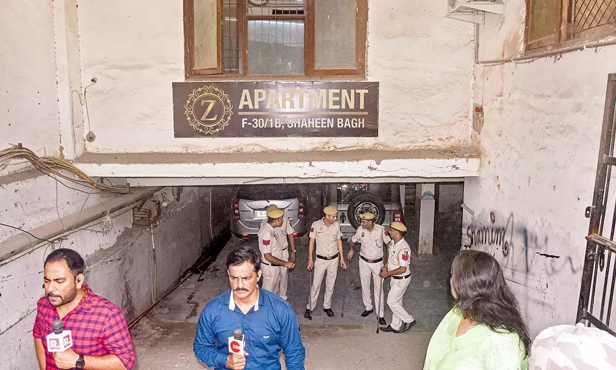 Police personnel deployed at PFI office building at Shaheen Bagh in New Delhi on Wednesday