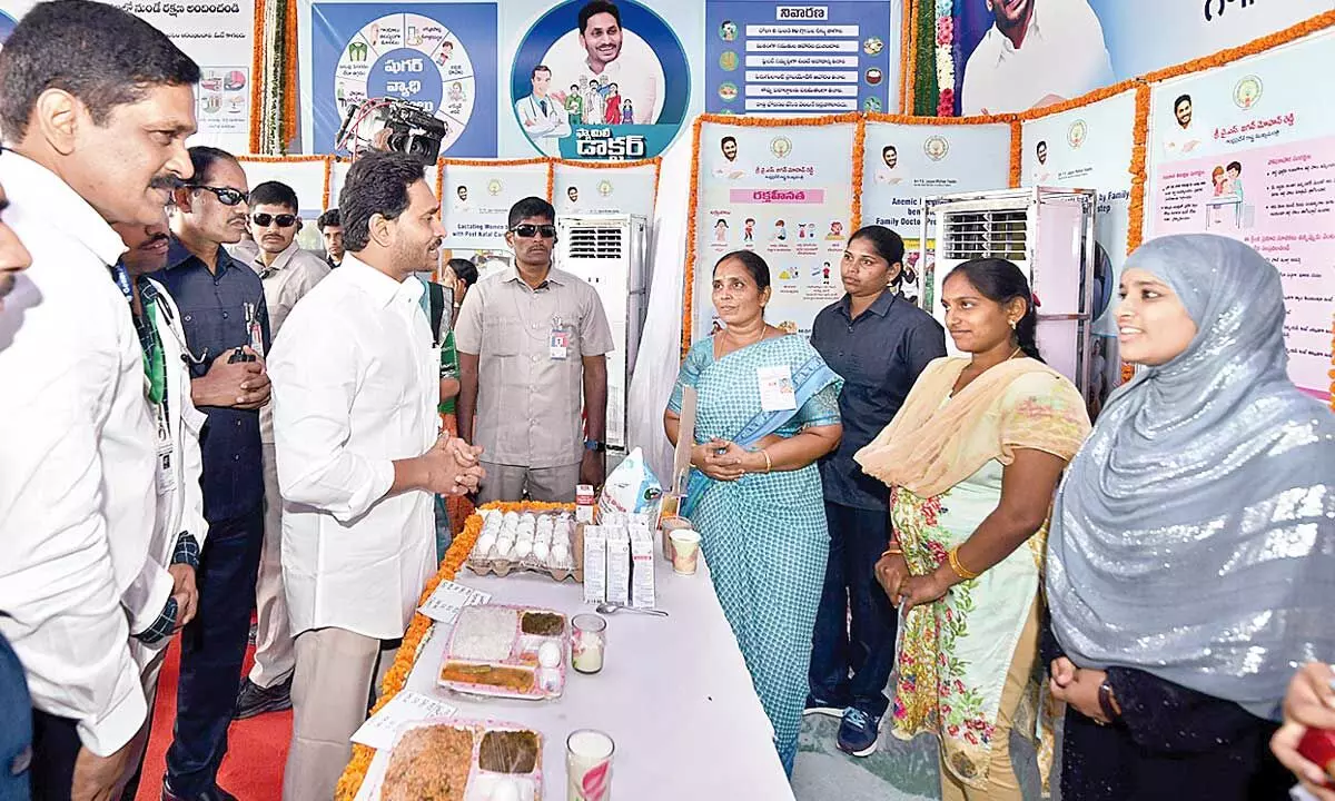 Chief Minister Y S Jagan Mohan Reddy interacting with health workers during his visit to Palnadu district on Thursday