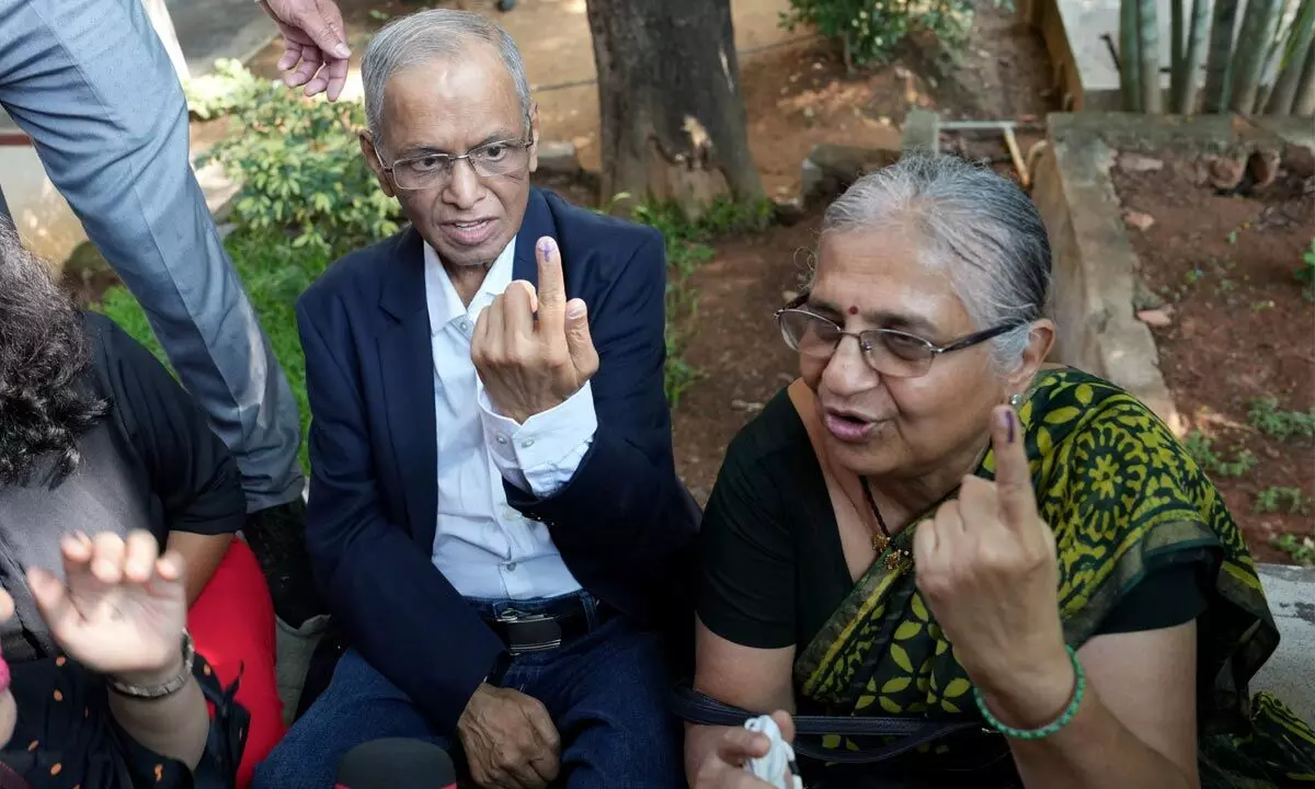 Infosys founder Narayana Murthy and Sudha Murthy after casting their votes