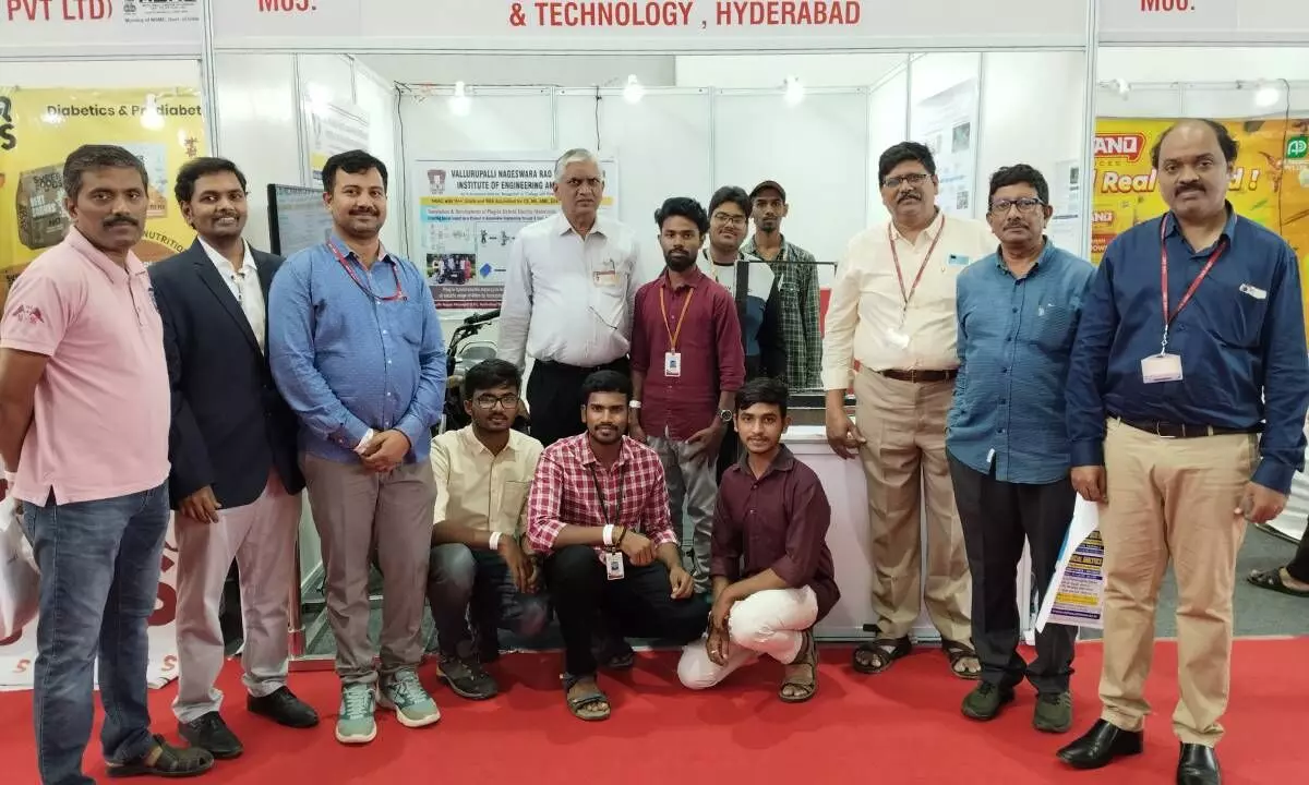 Prof CD Naidu, Principal, VNRVJIET; Dr S Pranavanand, Convener, Institute Innovation Council, VNRVJIET; Prof M Venkata Ramana, Coordinator, Entrepreneurship Development Cell, VNRVJIET and other staff with student innovators at the IITEX stall in Hyderabad on Thursday