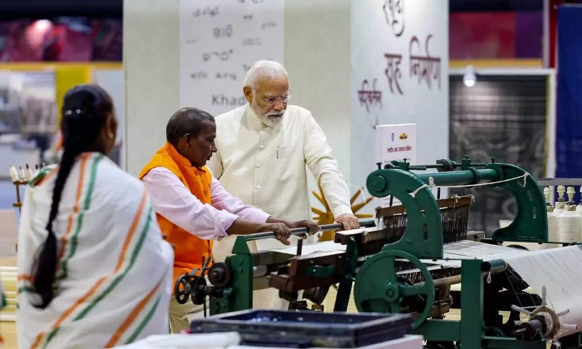 New Delhi: Prime Minister Narendra Modi visits an exhibition organised on the occasion of National Handloom Day at the Bharat Mandapam in the Pragati Maidan complex, in New Delhi, Monday, Aug. 7, 2023