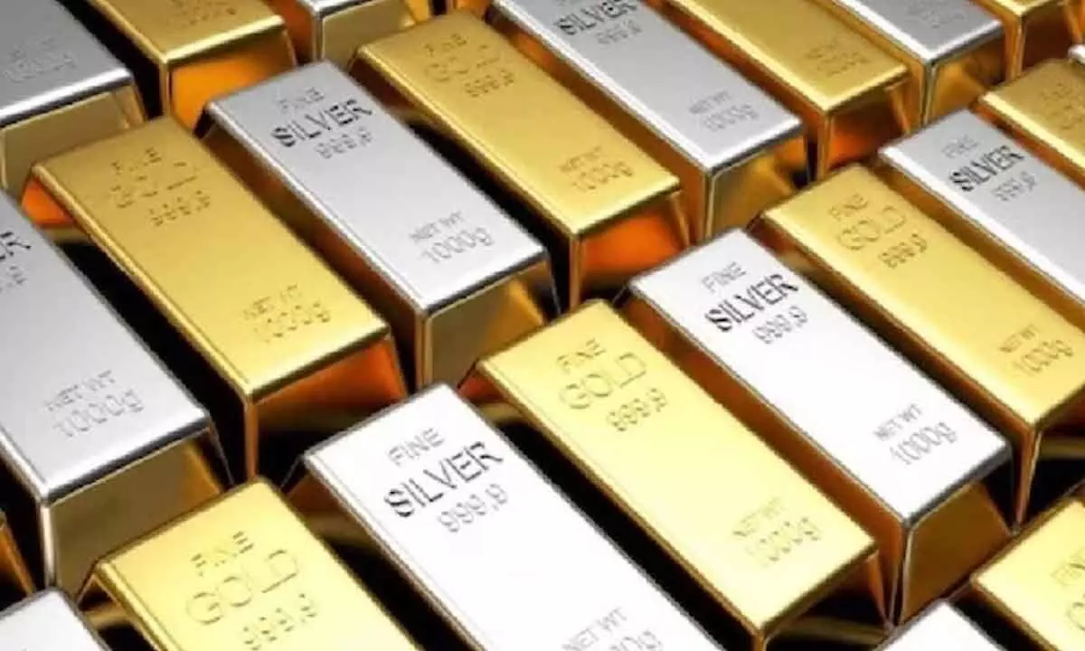 Gold declines, silver rises