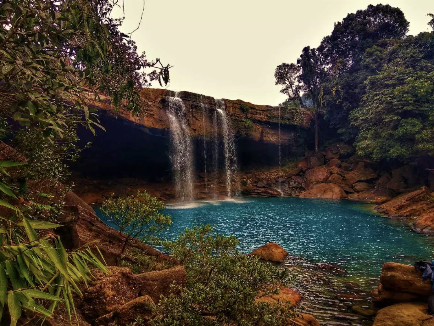 Unwind at Krang Suri waterfalls with charming local Khasi cuisine!