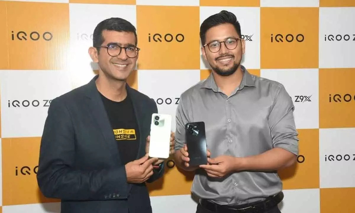 (L) Nipun Marya, CEO, iQoo holding the recently launched Z9x smartphone, in Hyderabad on Thursday