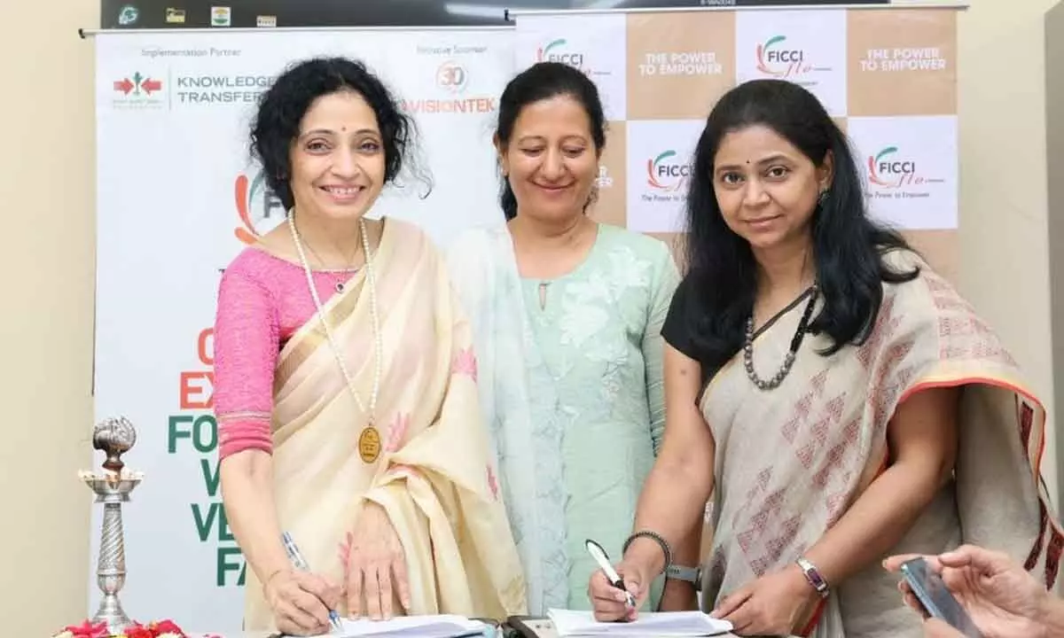 Priya Gazdar, Chairperson, FLO Hyderabad and U V L Ananda, Head-Corporate Communication, East West Seed India signing the MoU in Hyderabad on Thursday