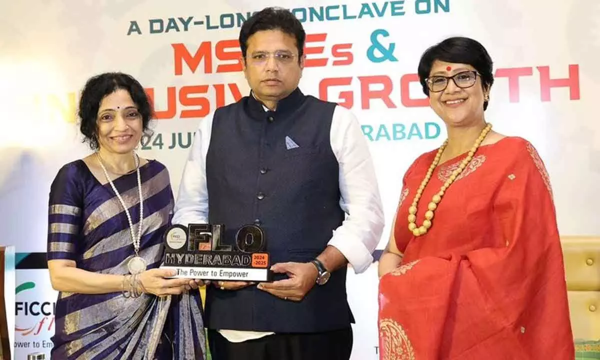 Priya Gazdar, Chairperson, FLO Hyderabad felicitating Telangana IT Minister D Sridhar Babu. Also seen is Joyshree Das Verma, National FLO president