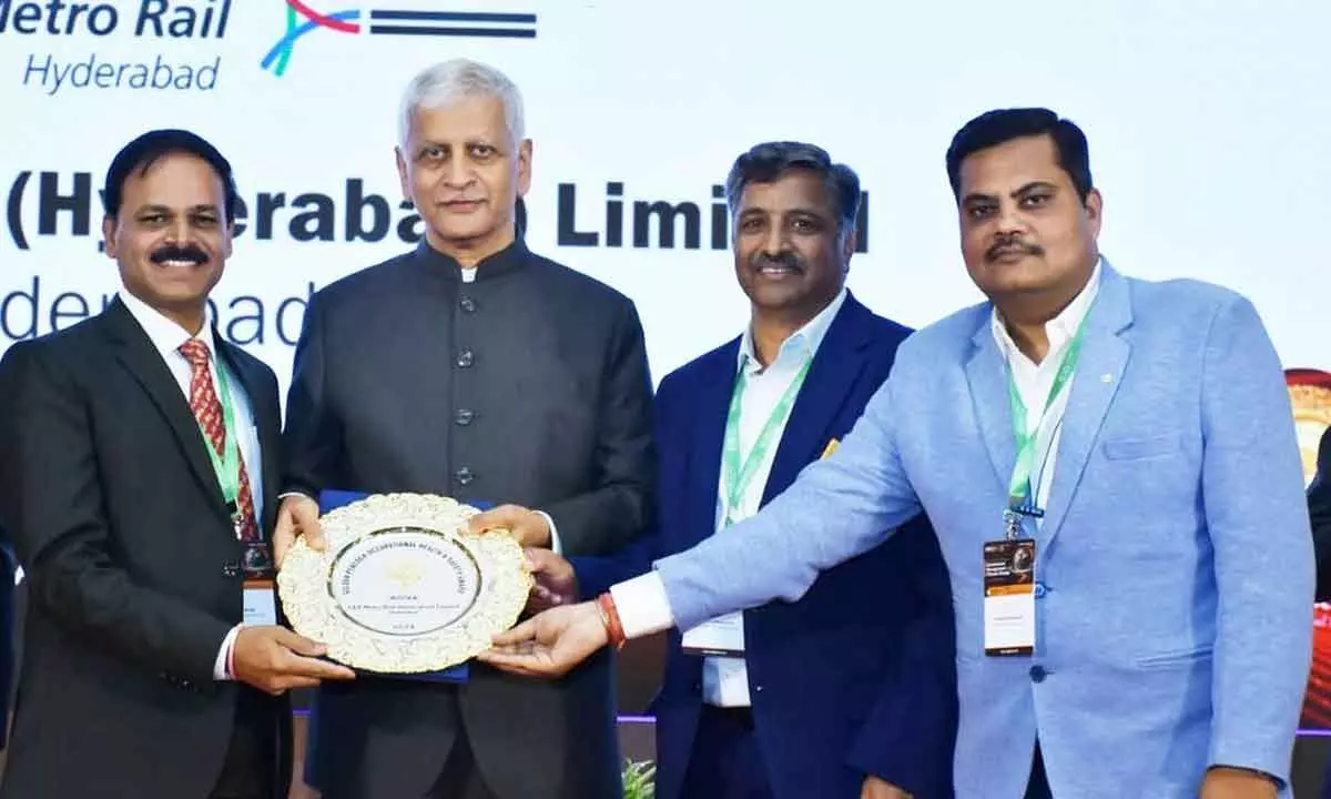 KVB Reddy, MD & CEO, L&TMRHL receiving the Golden Peacock Award from former chief justice of India Uday U Lalit in the presence of Sudhir Chiplunkar, COO of Hyderabad Metro Rail.