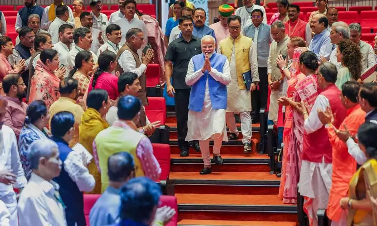 Prime Minister Narendra Modi being greeted during the NDA Parliamentary Party meeting at the Parliament, in New Delhi on Tuesday