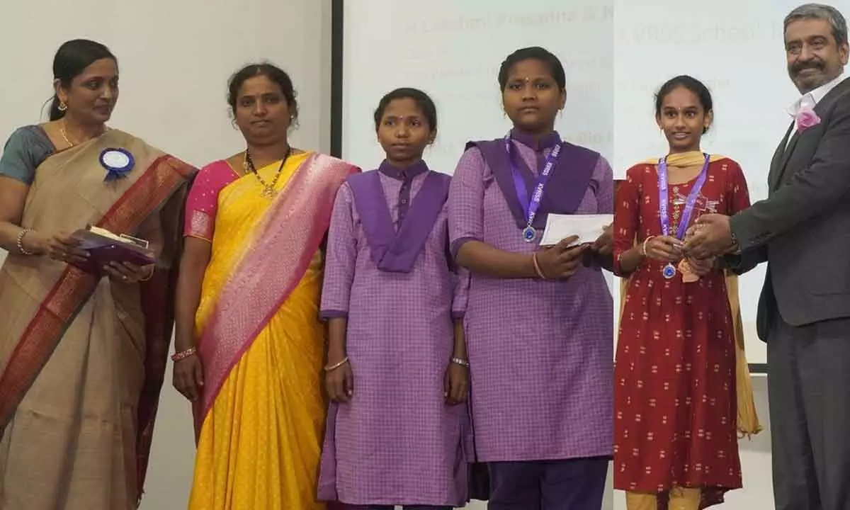 N Kusuma Latha  (Right) ZPHS Eluru  receiving KVRSS School Talent award for her science project from Dr Priya Abraham and Parto Prathimkar; N Lakshmi Prasanna and N Sravanthi receiving KVRSS School Talent award for project Sanitary Bio-Napkins