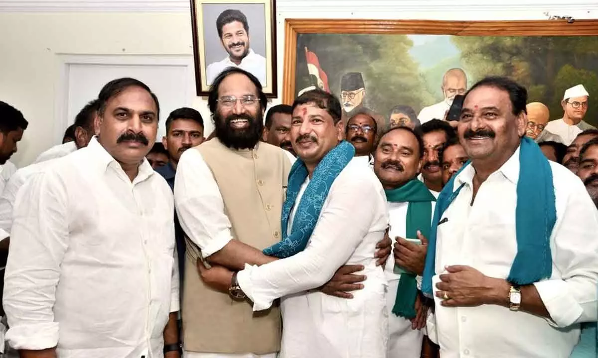 Civil Supplies Minister Capt N Uttam Kumar Reddy greets TPCC Kisan Cell president S Anvesh Reddy, as he assumes office as the Chairman of TGSDCL