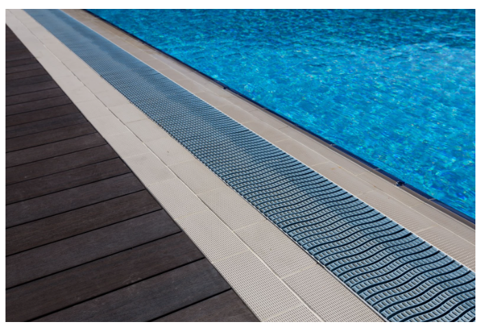 How Trench Drains Can Improve Drainage Around Pools, Driveways, and Patios