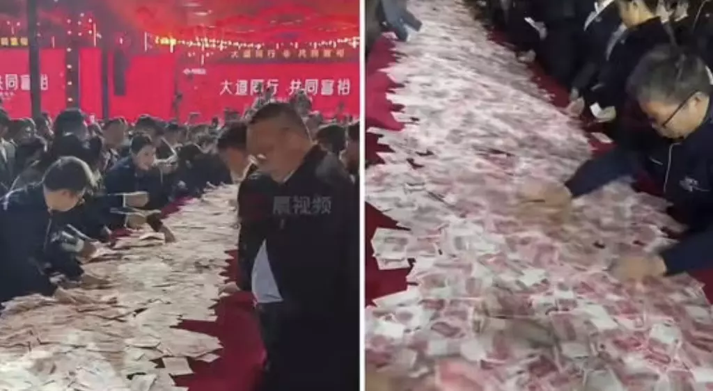 Chinese company stuns employees with bumper bonus of Rs. 80 crore in Cash on the Table!